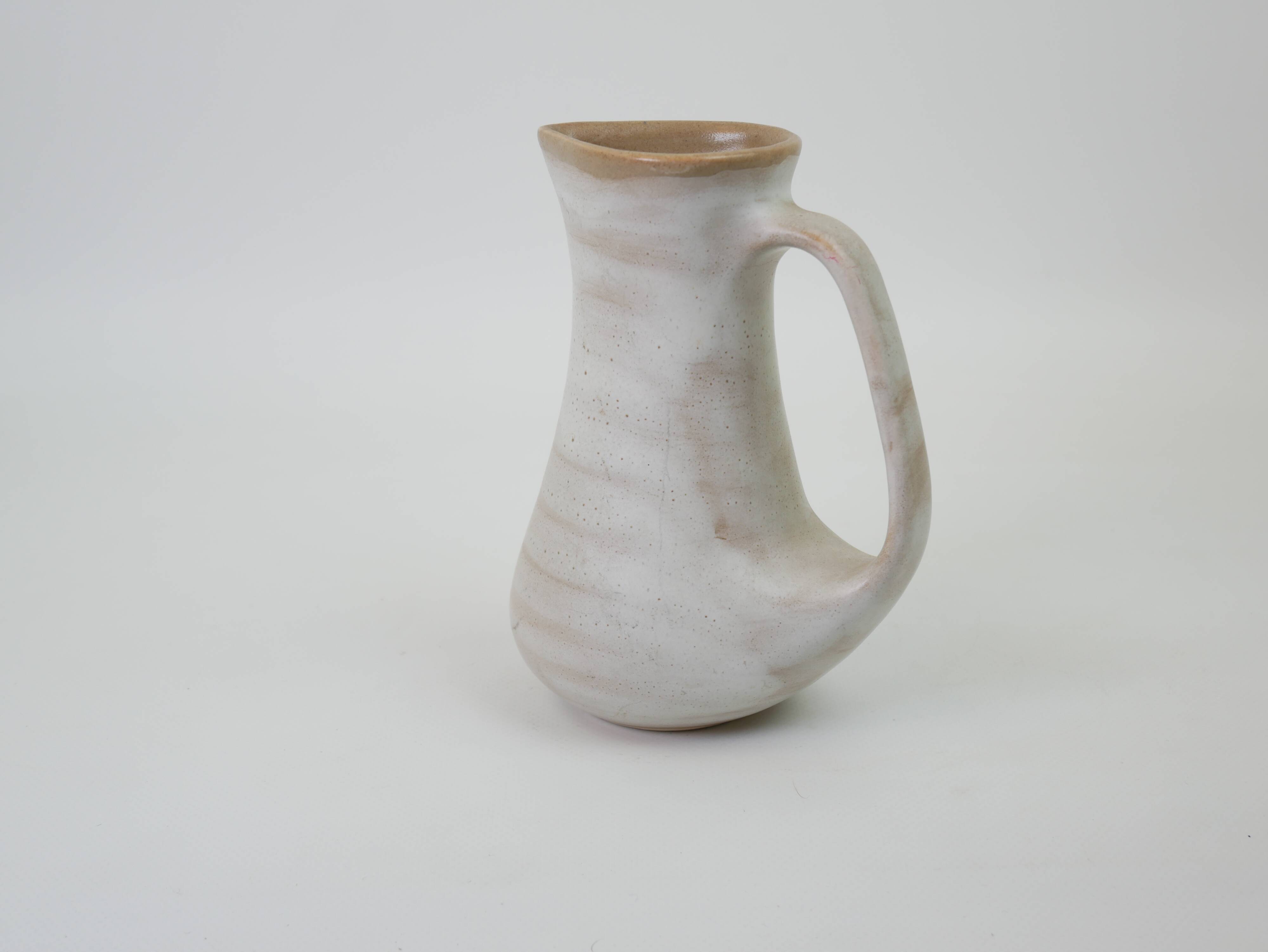 Signed white beige ceramic pitcher