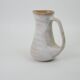 Signed white beige ceramic pitcher
