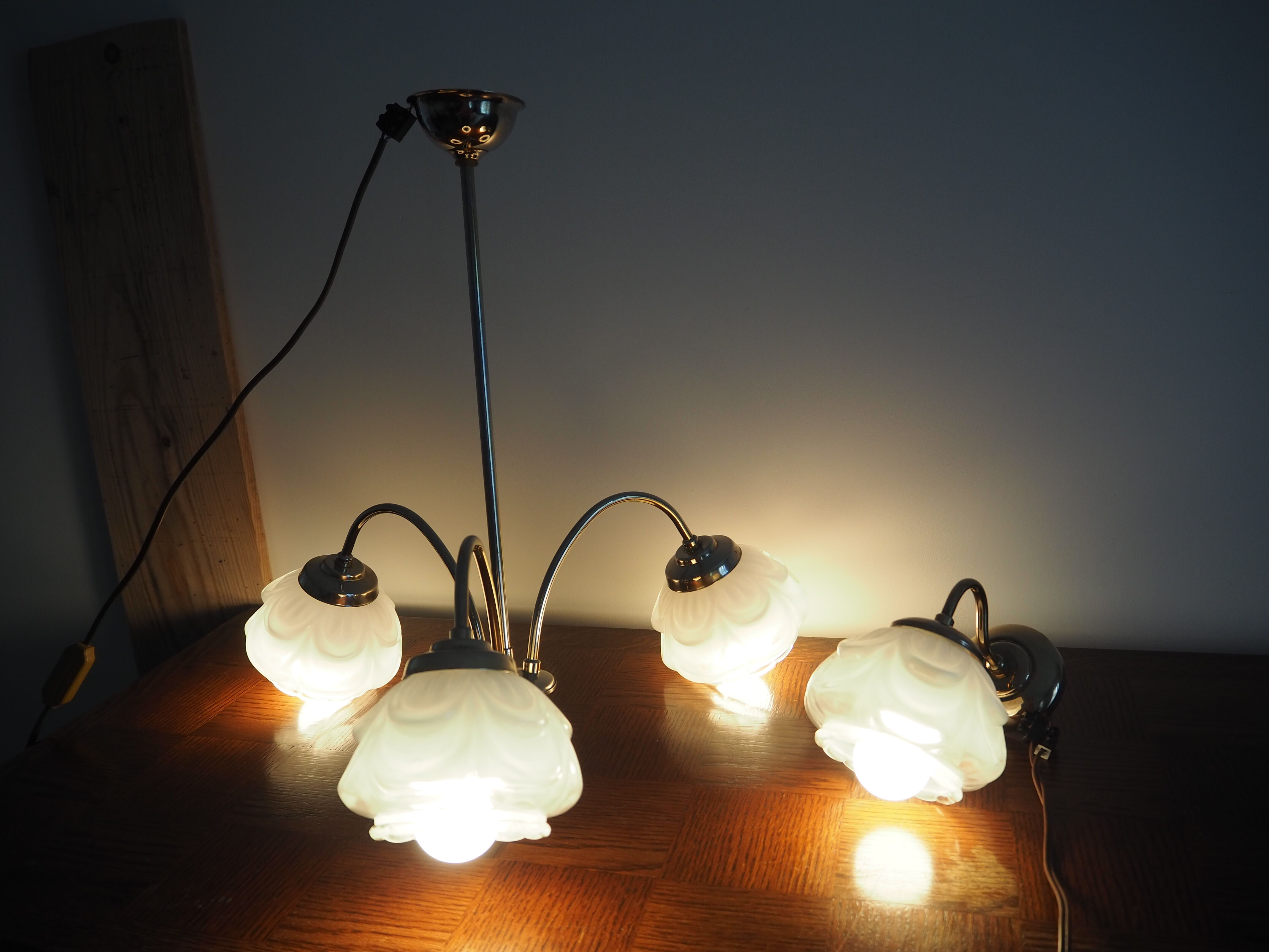 Brass wall lamp and white glass globe from the 1950s-1960s.