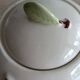 Slush teapot with embossed fruit decoration