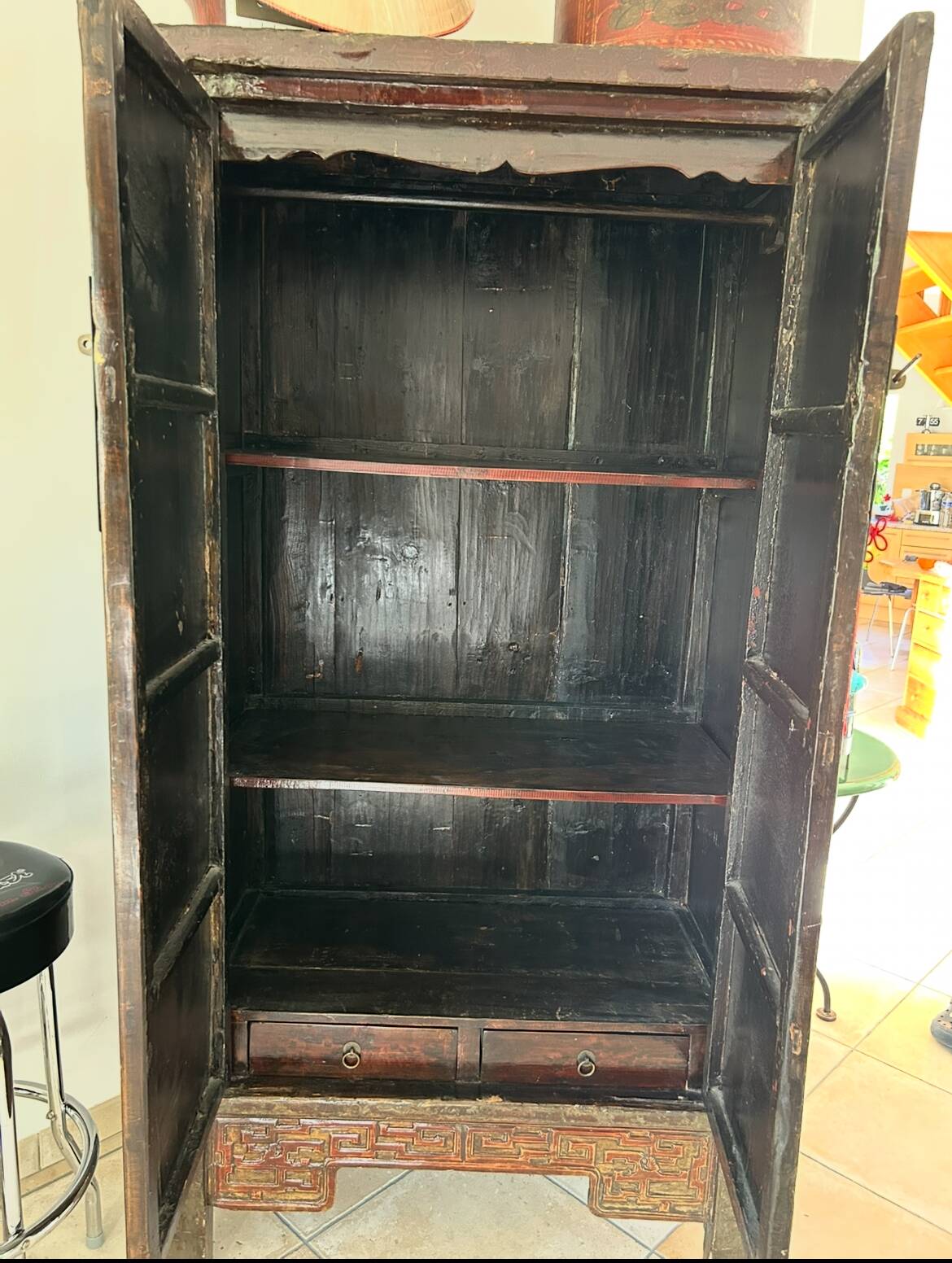 Antique Chinese wardrobe in carved elm.