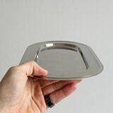 Small antique tray made of lightweight metal.