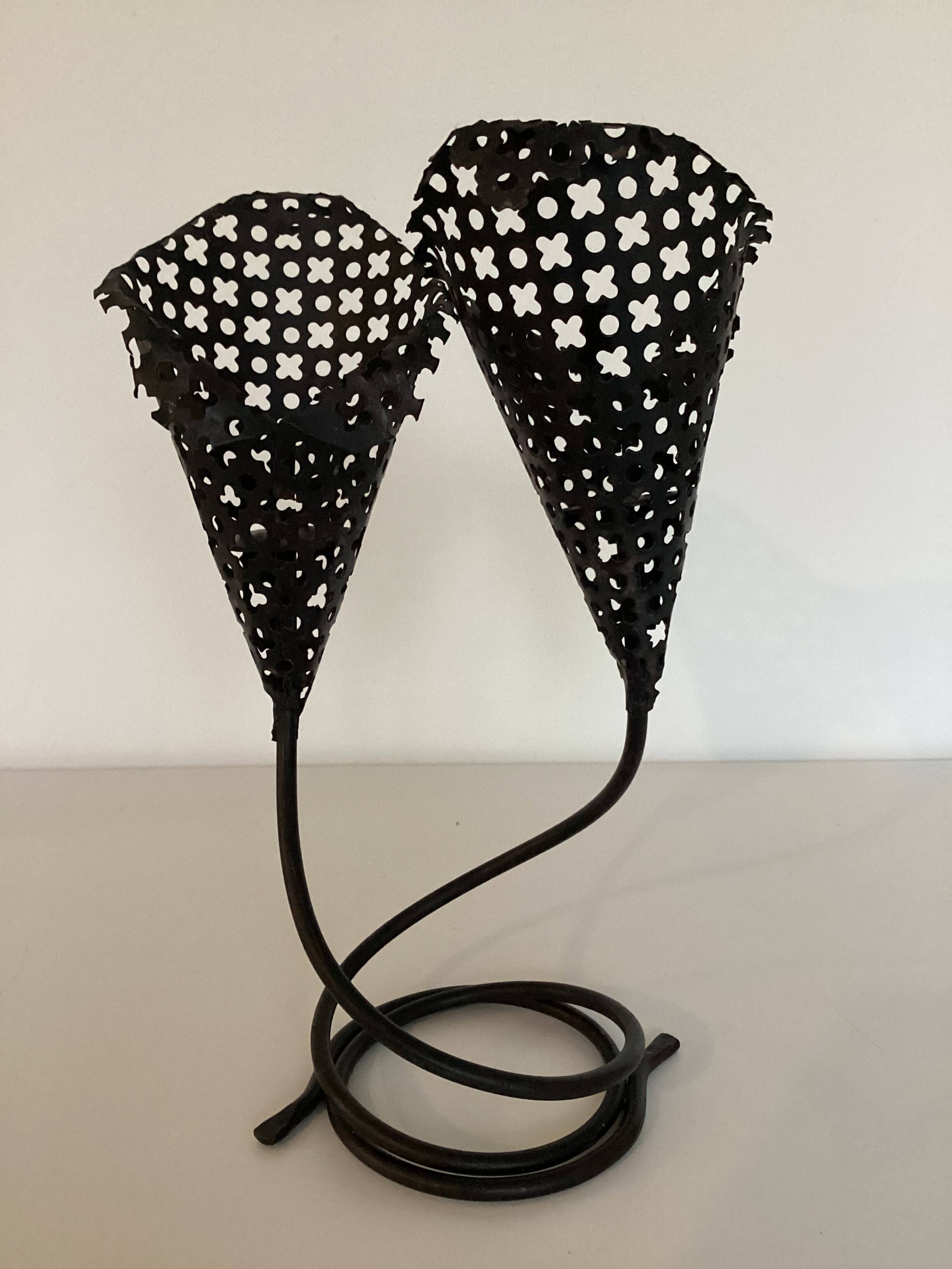 Perforated metal candle holder