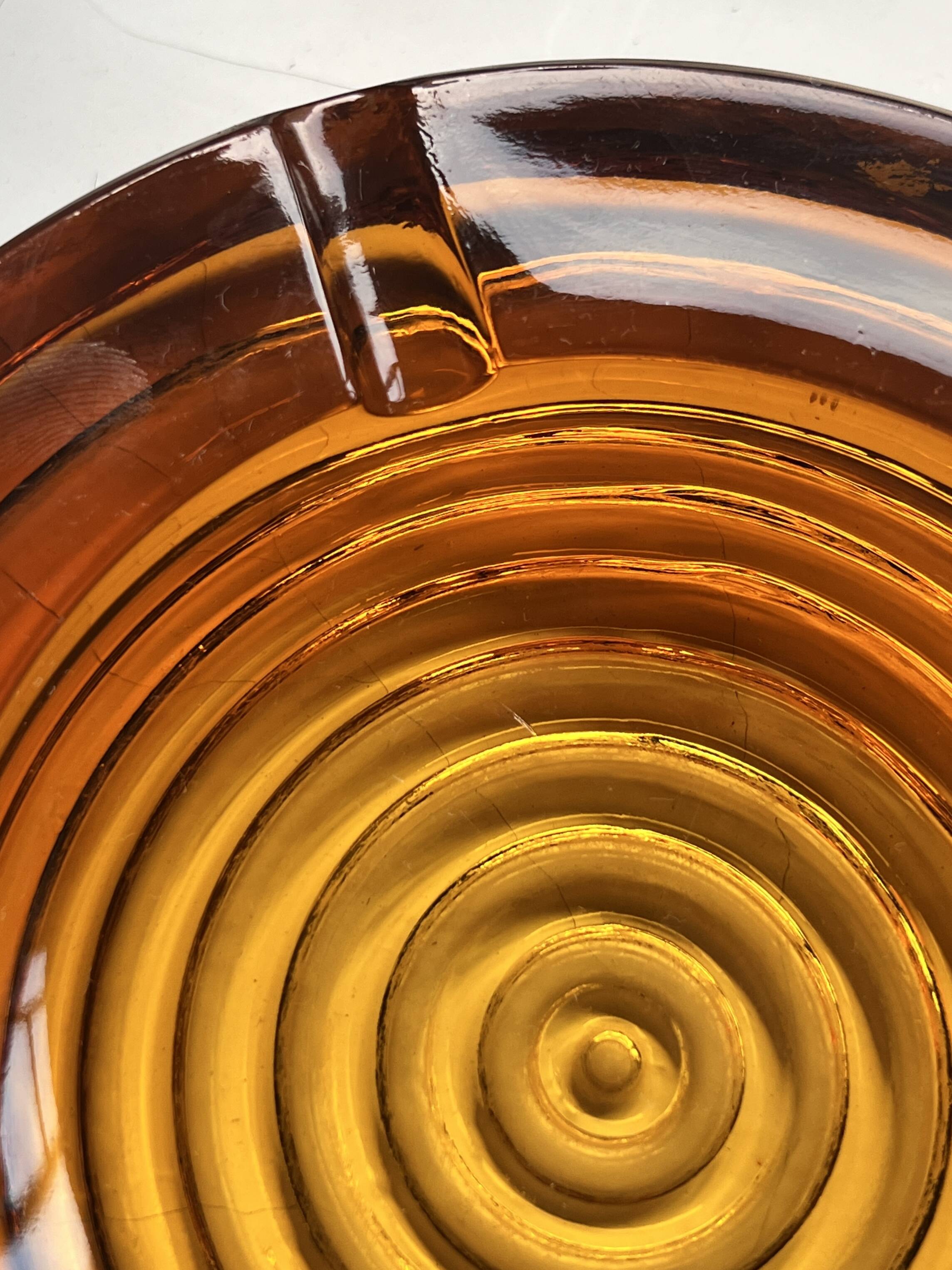 Amber pressed glass ashtray, 1970s design.