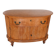 Half-moon commode from 1900 in lemon tree veneer, curved shape.