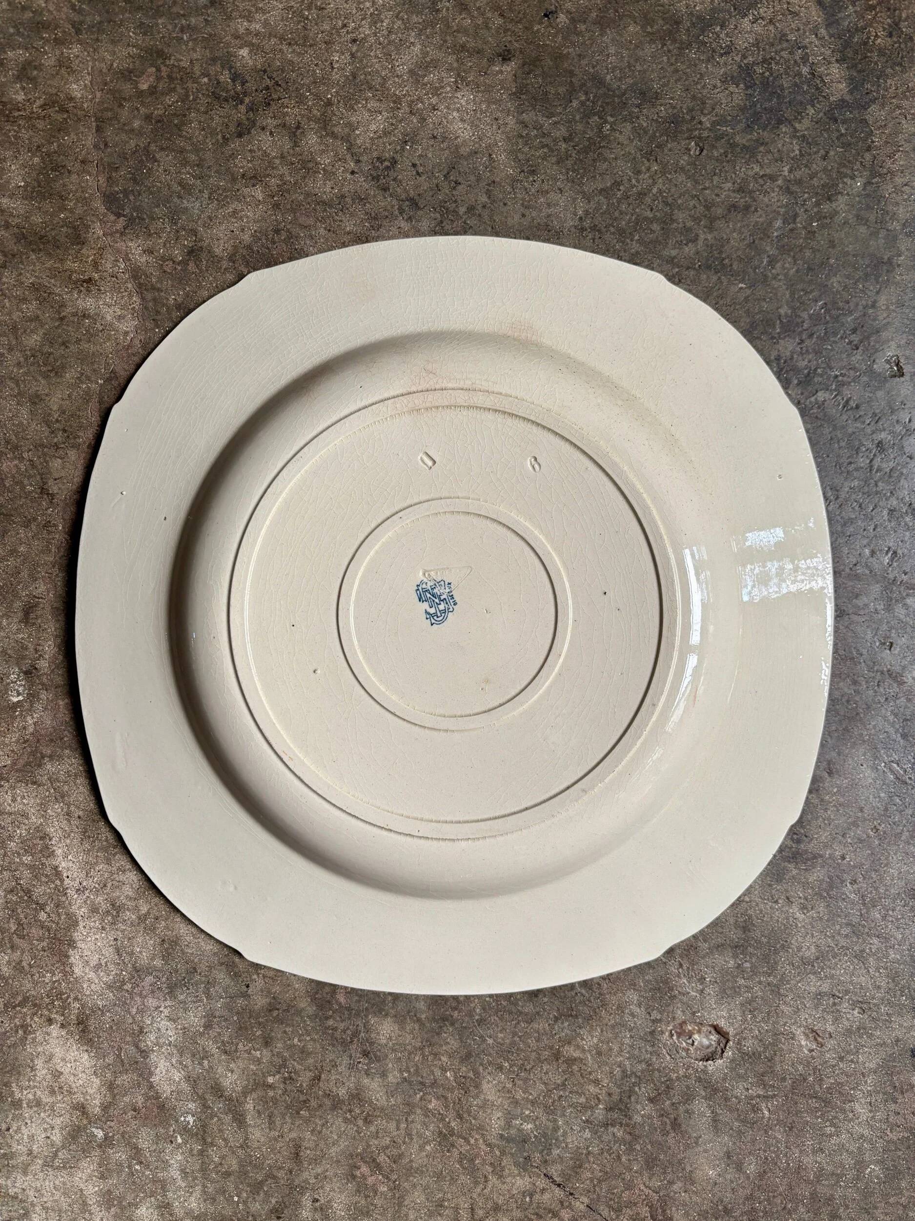 Medium square hollow plate Gien in blue ironstone, service "Birds" around 1870.