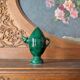 Decorative piece in green glazed stoneware, jug shape.