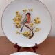 Two Limoges porcelain plates signed M. Hague.