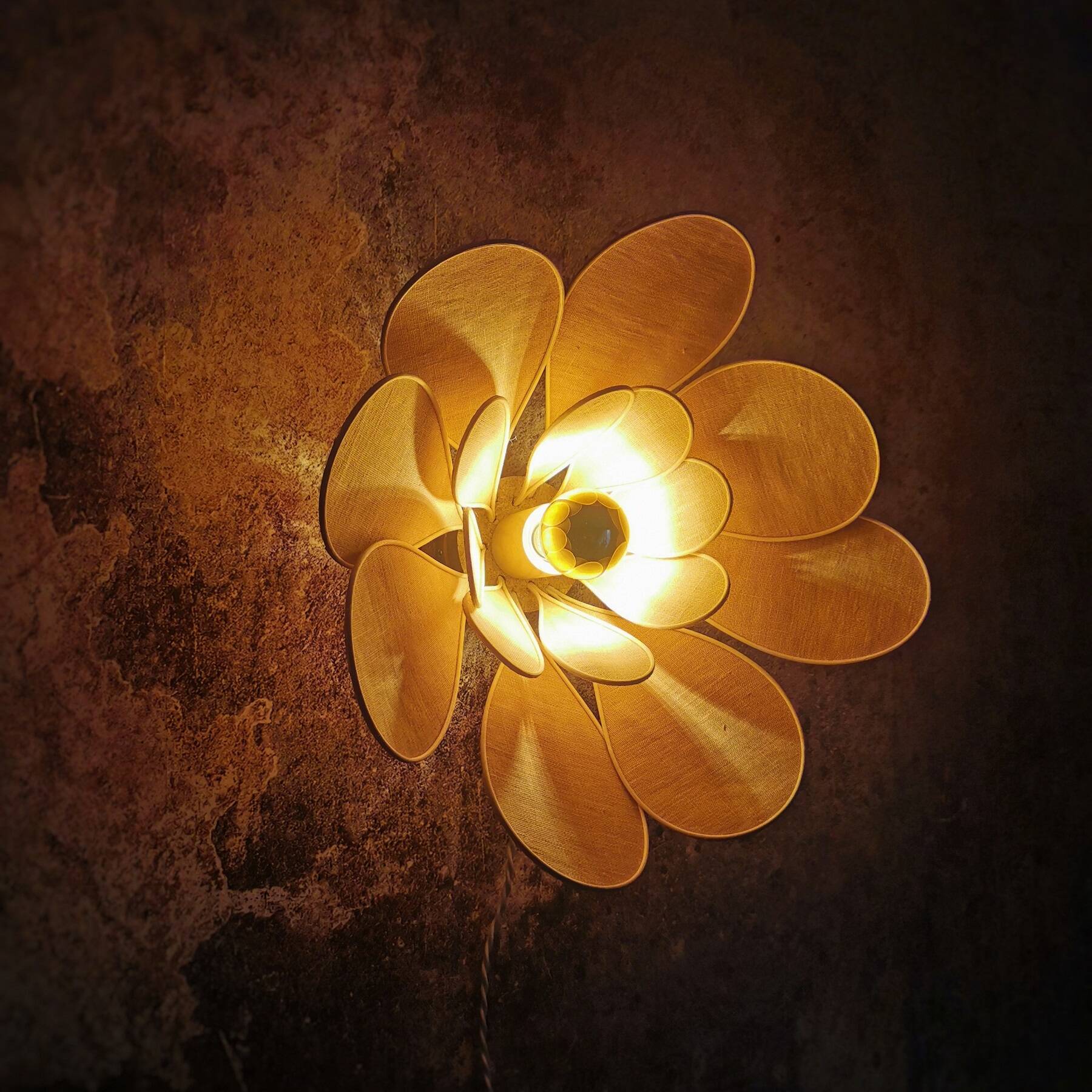 Flower wall light made of rattan and old pink linen petals