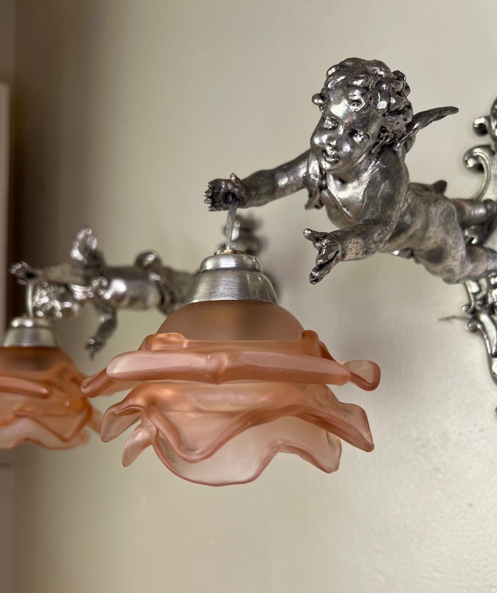 Pair of wall sconces, cherubs, angels, silvered