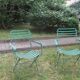 Pair of mid century distressed painted iron garden chairs
