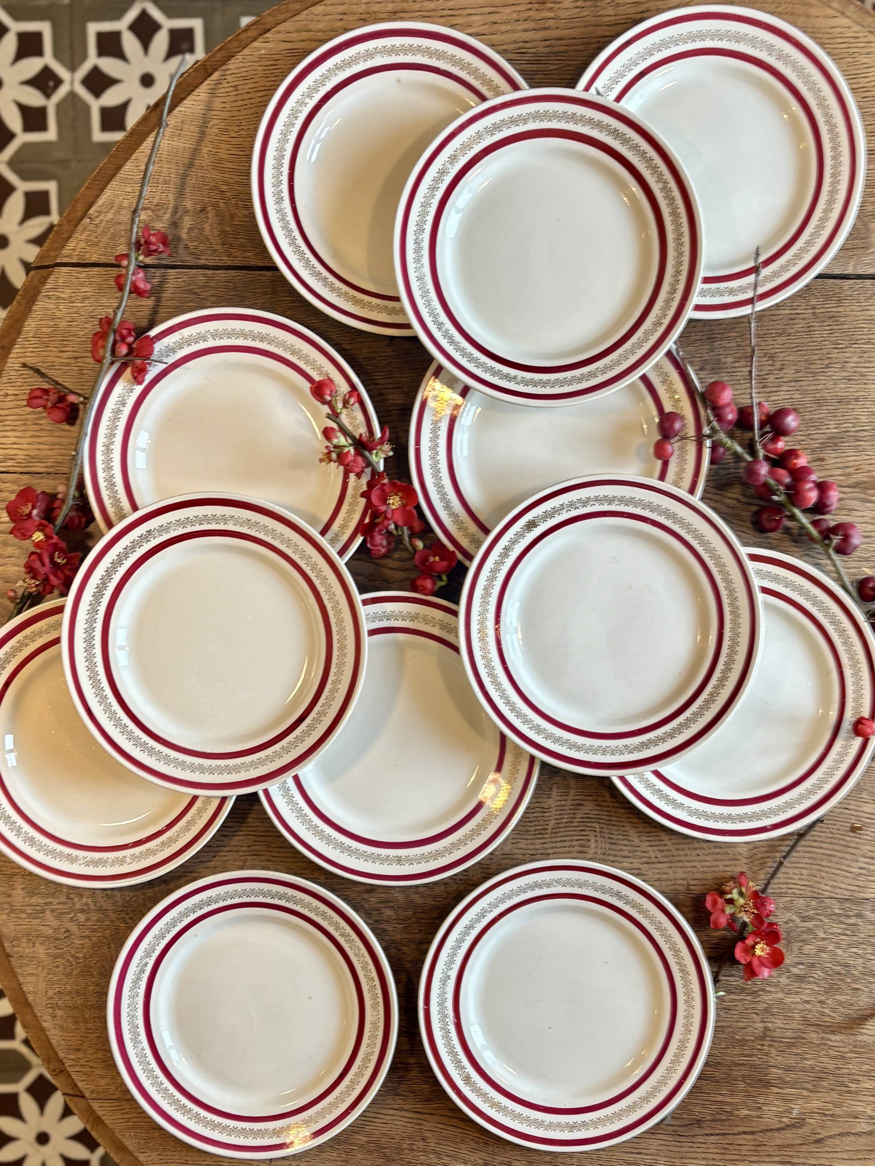 Set of 12 antique Gien red and gold dinner plates.