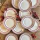 Set of 12 antique Gien red and gold dinner plates.