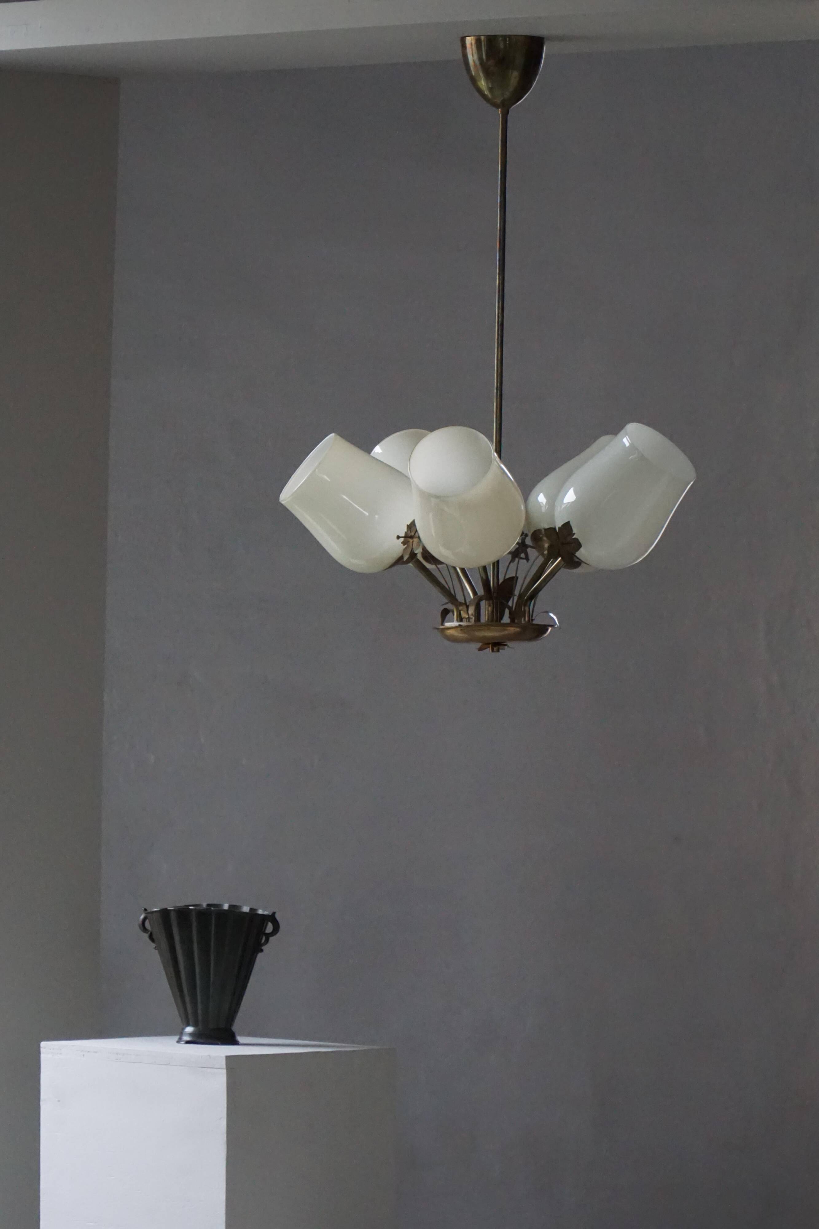 Five-branch brass and glass chandelier by Paavo Tynell for Idman OY Finland, 1940s.