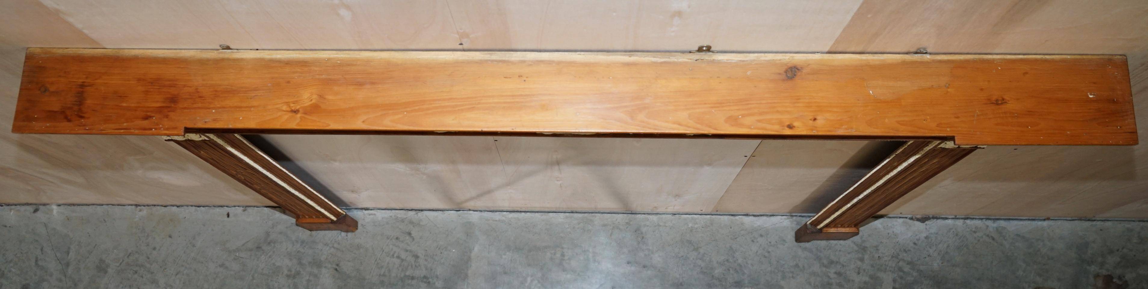 Victorian antique fireplace in tarred pine and sculpted gesso.