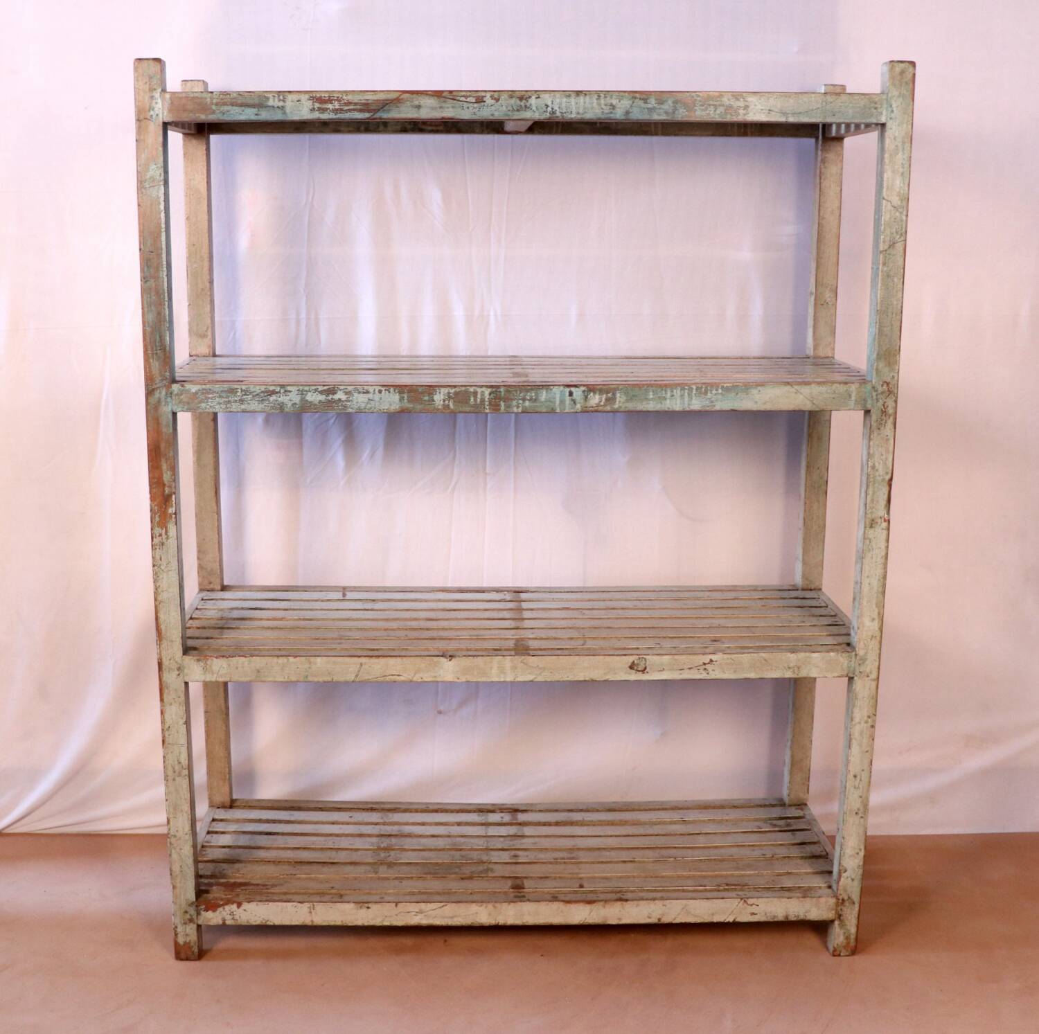 Teak bookshelf with original off-white patina.