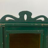 Wall vitrin with pediment