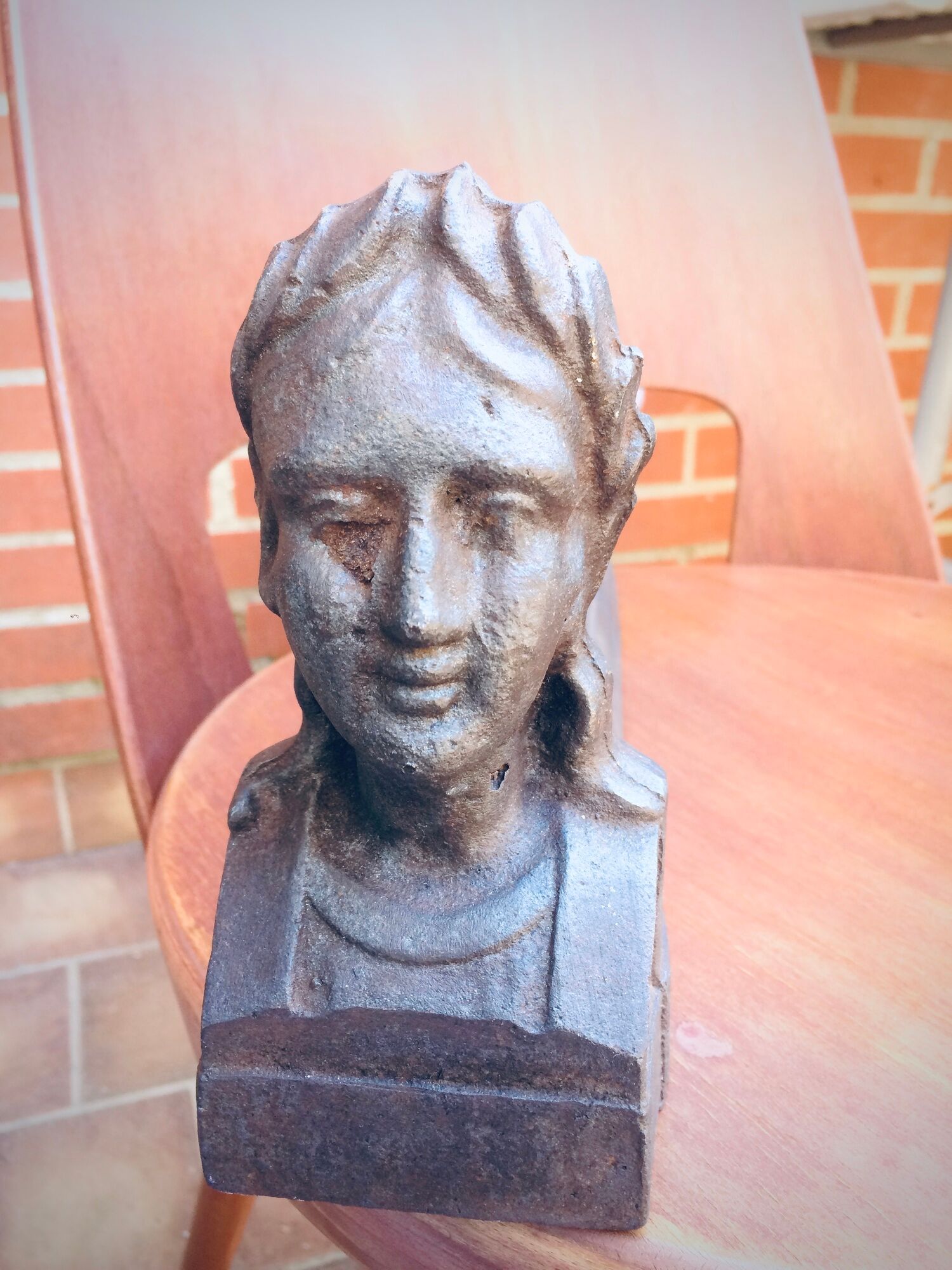 Pair of cast-iron chenet characters with laurels