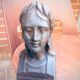 Pair of cast-iron chenet characters with laurels