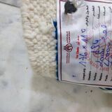 White and blue handwoven rug in natural wool