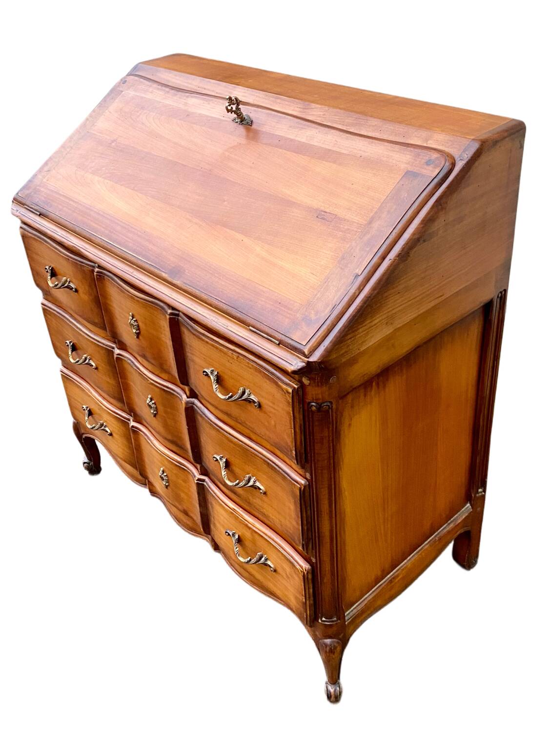 Secretary desk called "scriban" in Louis XV style made of fruitwood.