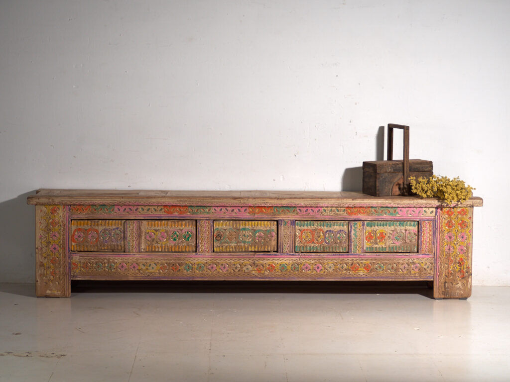 Antique carved low cabinet with drawers in pine – Xinjiang, circa 1900