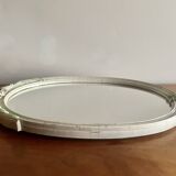 Vintage oval mirror in carved wood in pastel tones