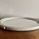 Vintage oval mirror in carved wood in pastel tones