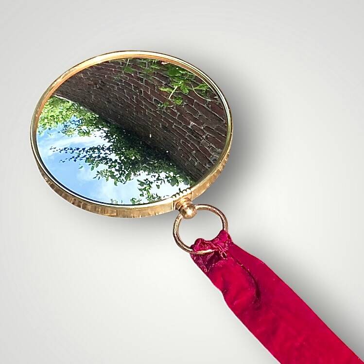 Antique convex "witch's eye" mirror