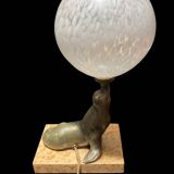 Lamp representing a seal on a marble base