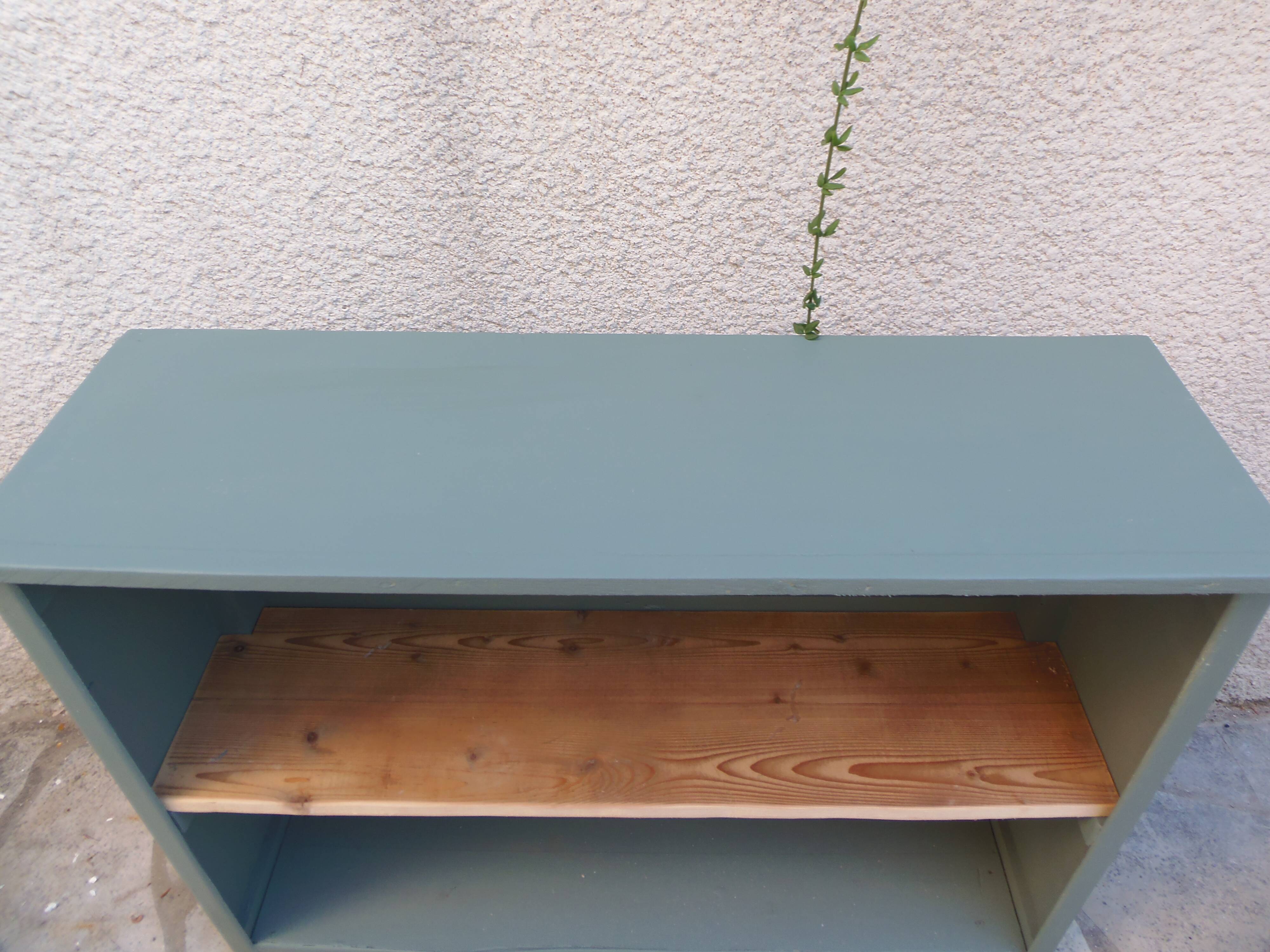 Vintage workshop furniture transformed into a re-enchanted bookshelf in smoky green.