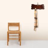 Art Nouveau style coat rack in oak with brass hooks, France ca. 1915