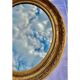 Oval wall mirror in gilded wood late nineteenth