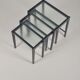 Set of nesting tables in black stained wood and glass top, 1960s