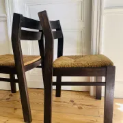 Pair of straw-seated wooden chairs in the regain style.