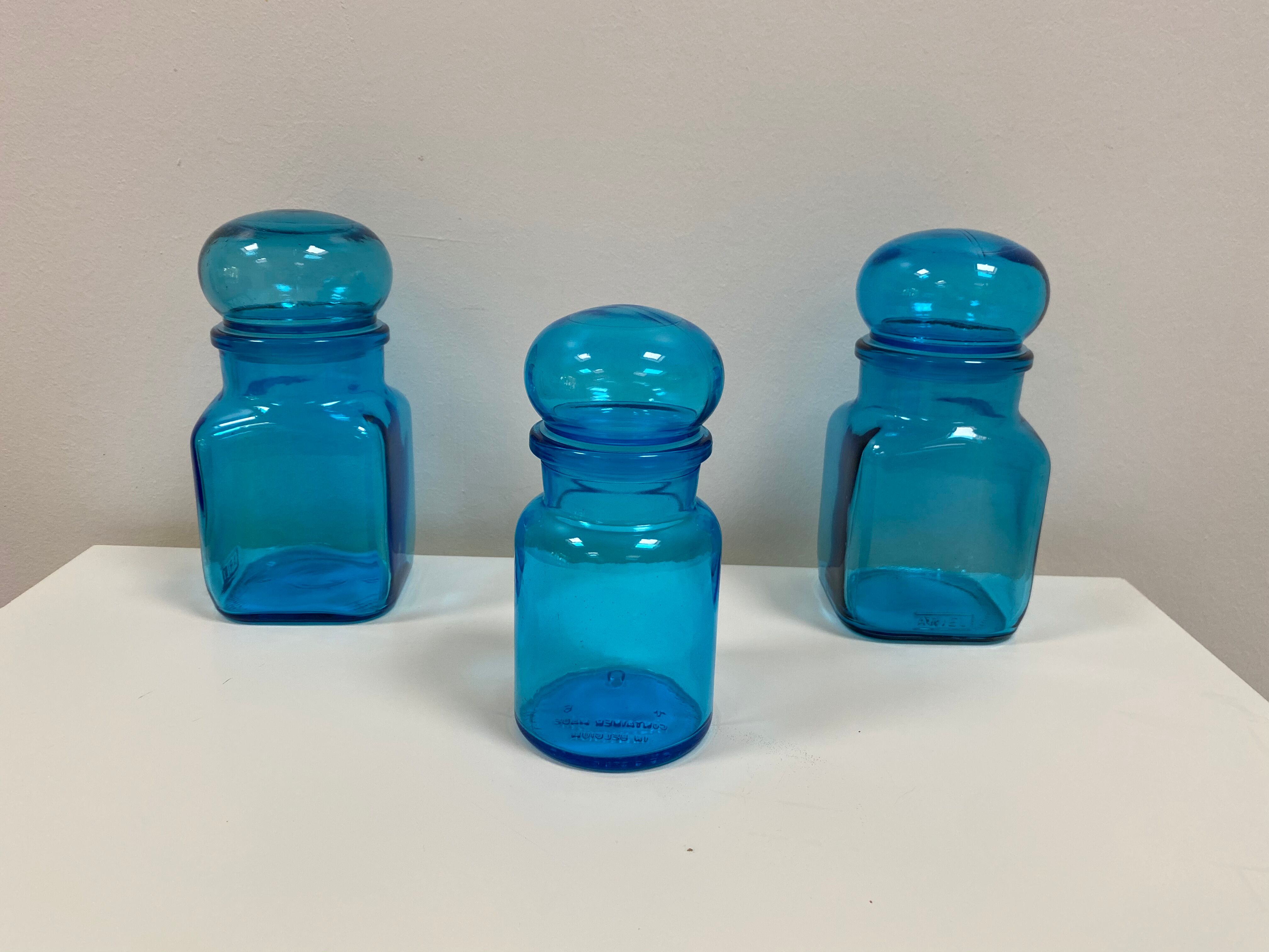 Trio of vintage turquoise blue glass jars