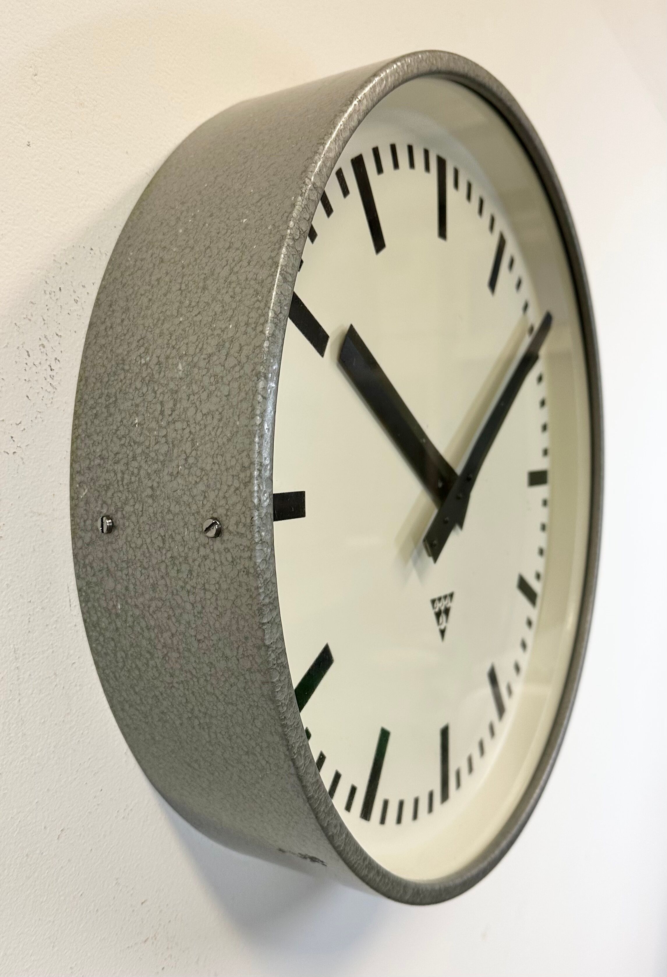 Grey industrial factory wall clock from pragotron, 1960s