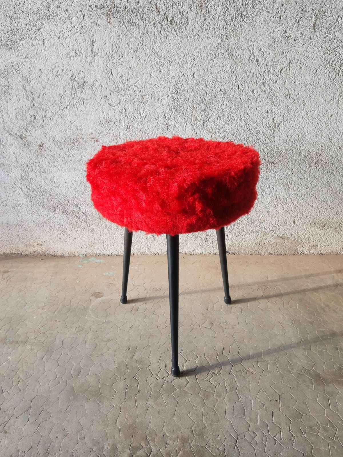 Tripod stool with vintage red moumoute seat