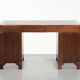 Old wooden English desk from the early 20th century with brass elements