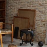 Side table in hardwood ebony with three elephant head-shaped legs, Eastern India, 1920s.