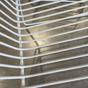 Many handcrafted wrought iron chairs