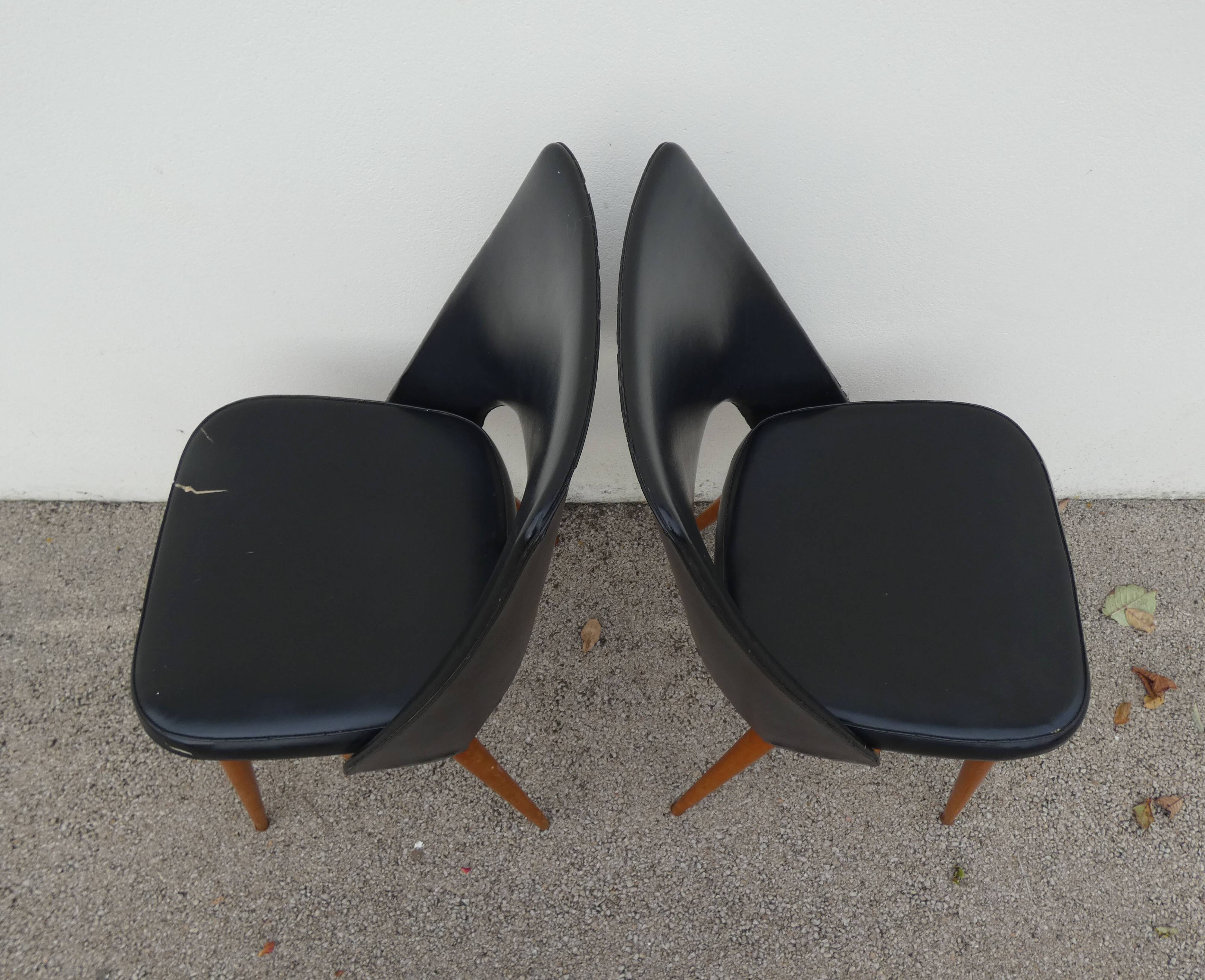2 chairs in black skai compass legs Louis Paolozzi