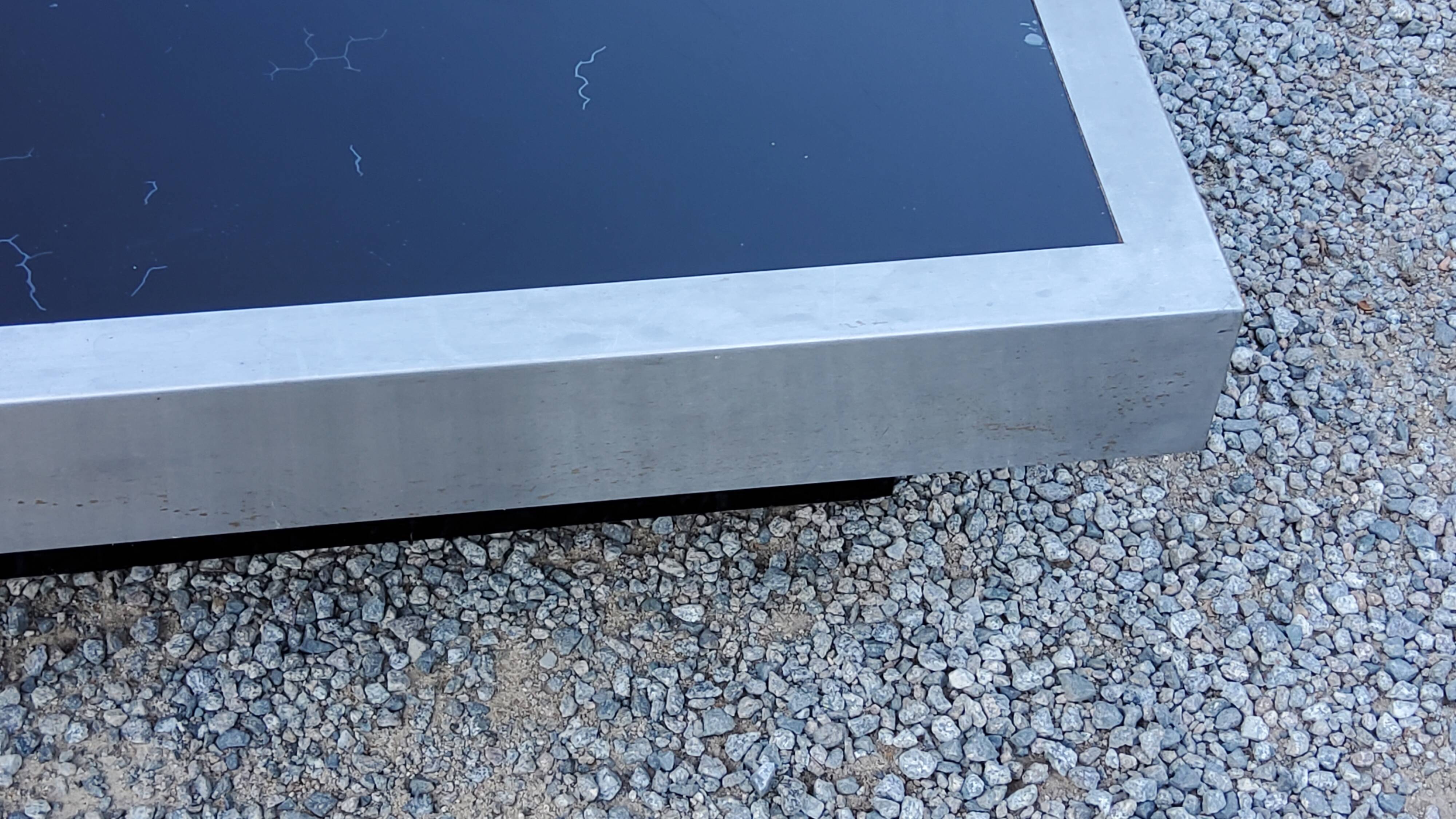 Coffee table in brushed steel and black tinted glass from the 70s
