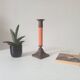 Vintage candlestick in solid gilded brass and orange wood.