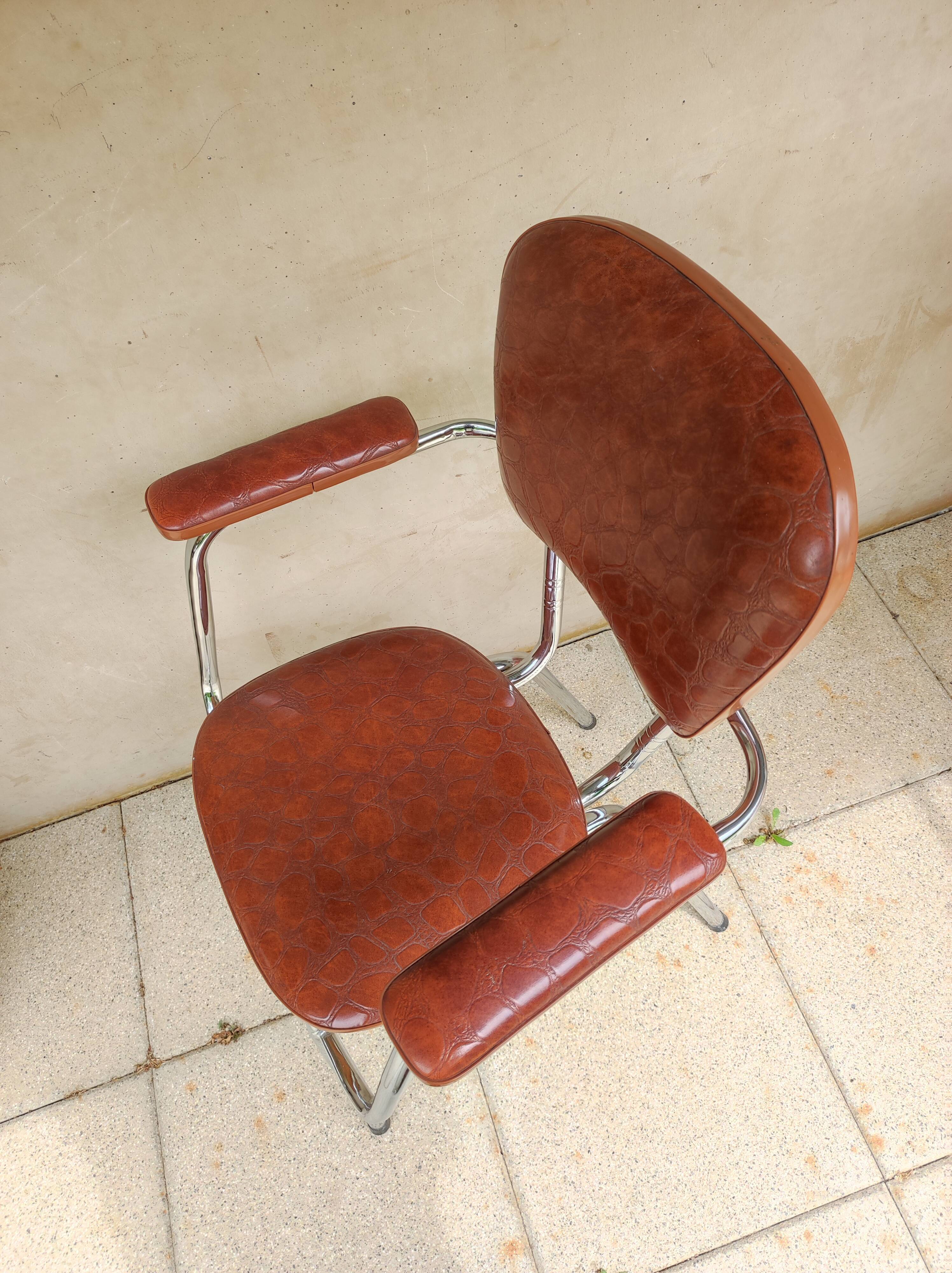 Stainless steel skaï armrest chair from 1958