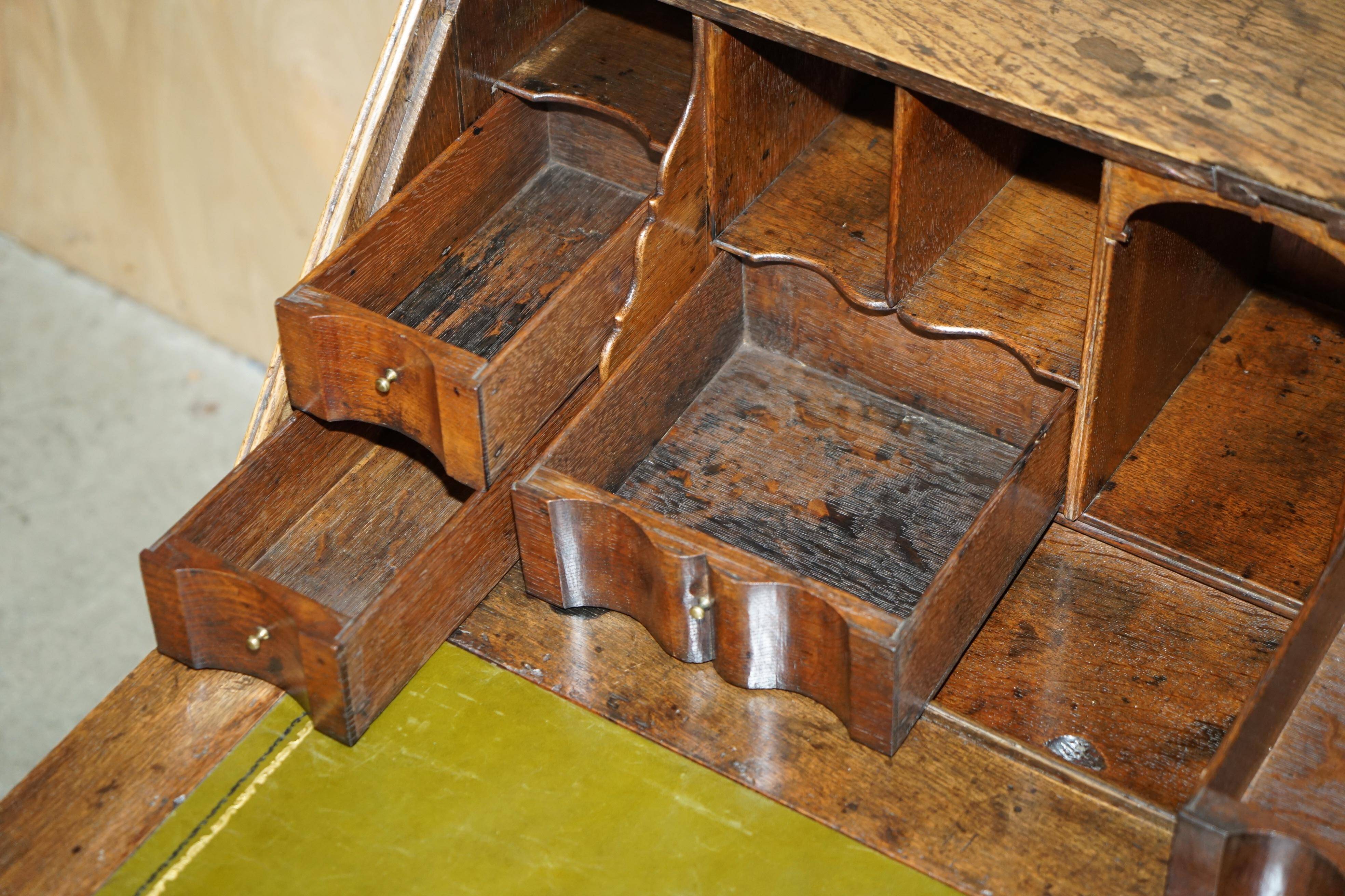 Ancient Georgian writing desk circa 1760 with a leather top.