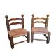 Pair of low fireplace chairs in turned wood and straw, Charles style.