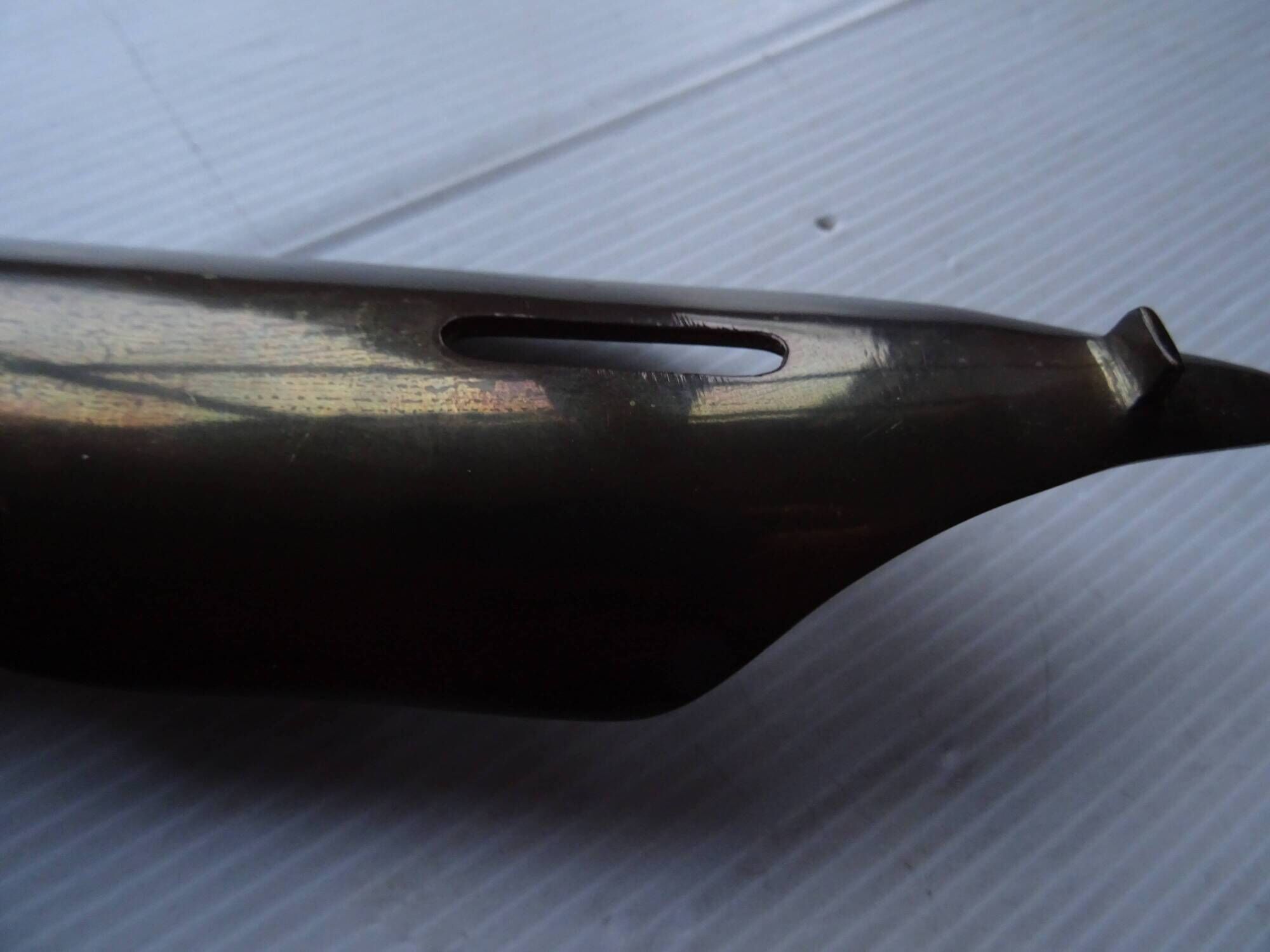 Empty feather holder bronze office pocket representing a pen feather