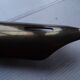 Empty feather holder bronze office pocket representing a pen feather