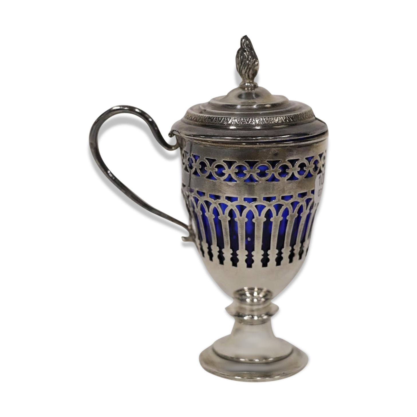 Solid silver mustard tree whose open body rests on a round pedestal.